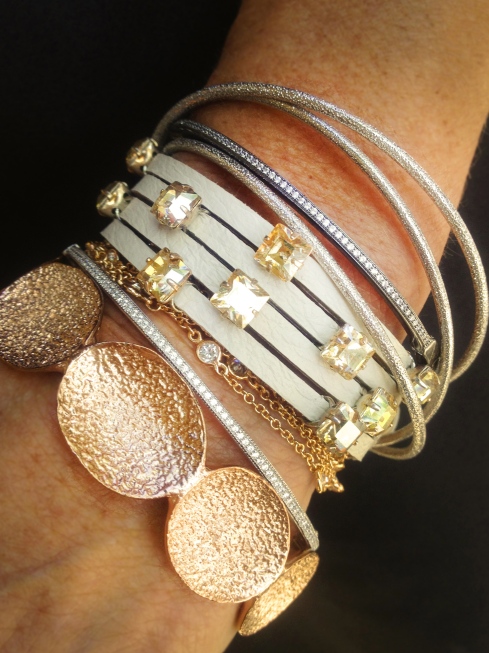 From top to bottom: Sharelli Sterling Dust Sterling Silver Bangles, Crislu Oxidized CZ Bracelet, Ted Rossi Champage Crystal Leather Bracelete, Beje CZ by the Inch Wrapped Necklace, Crislu Platinum Silver Bracelet, and Melinda Maria Bracelete